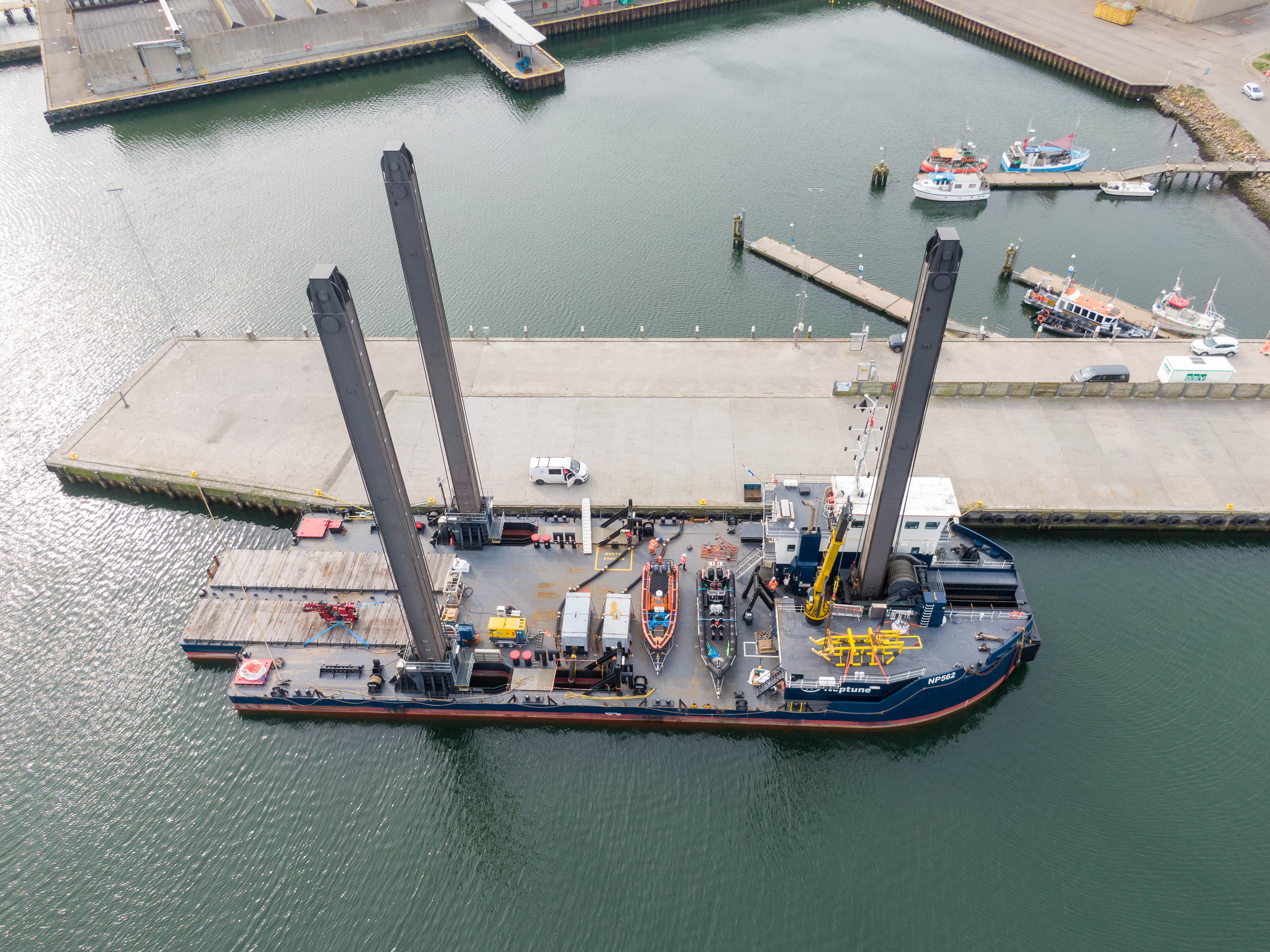 Vessel assisted by tugboat at Hvide Sande Harbor